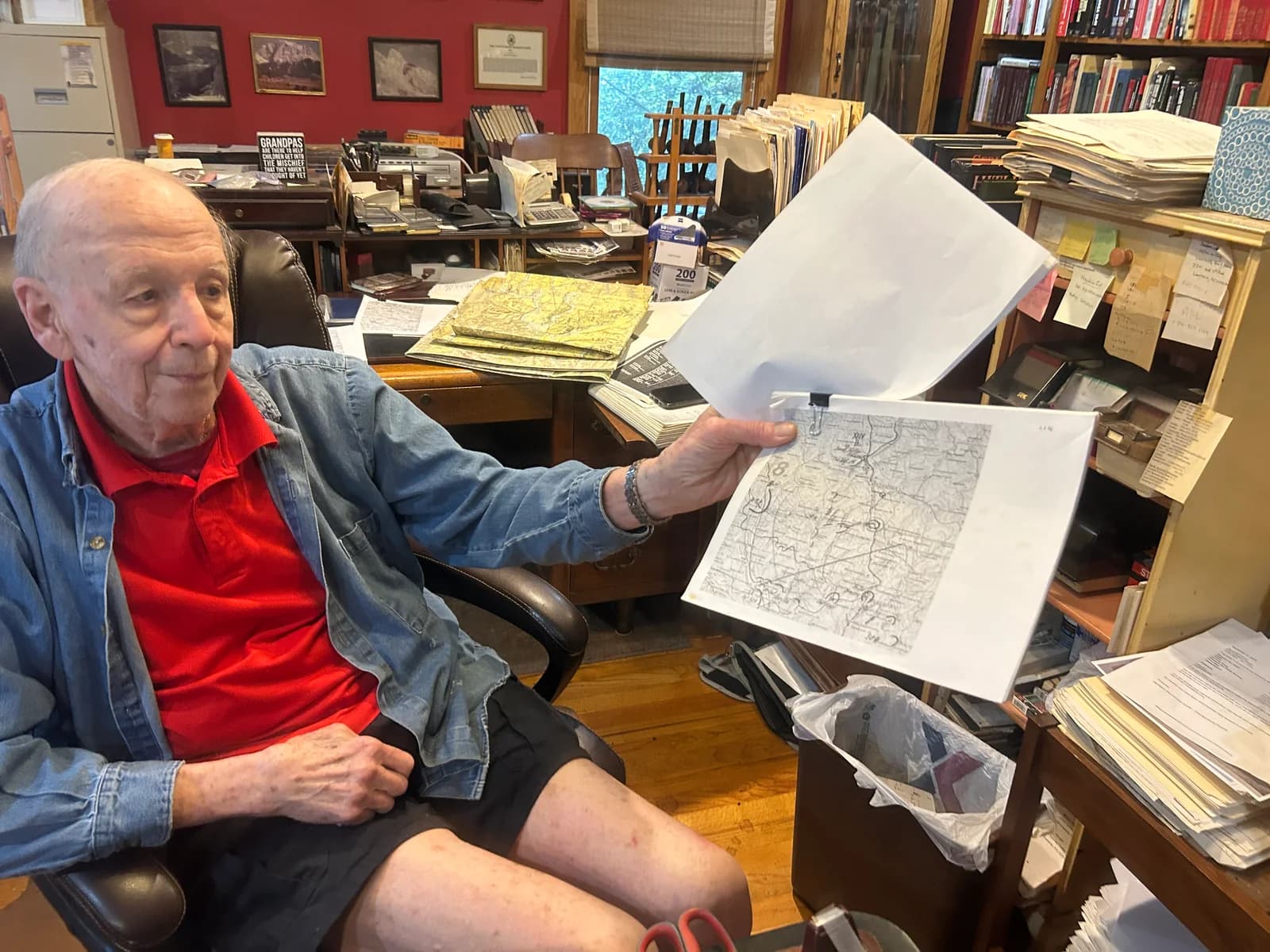 David Glantz holding a historical map used as reference material.